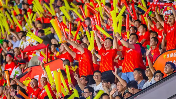 Mixed-race boy thumbs up for Foshan football